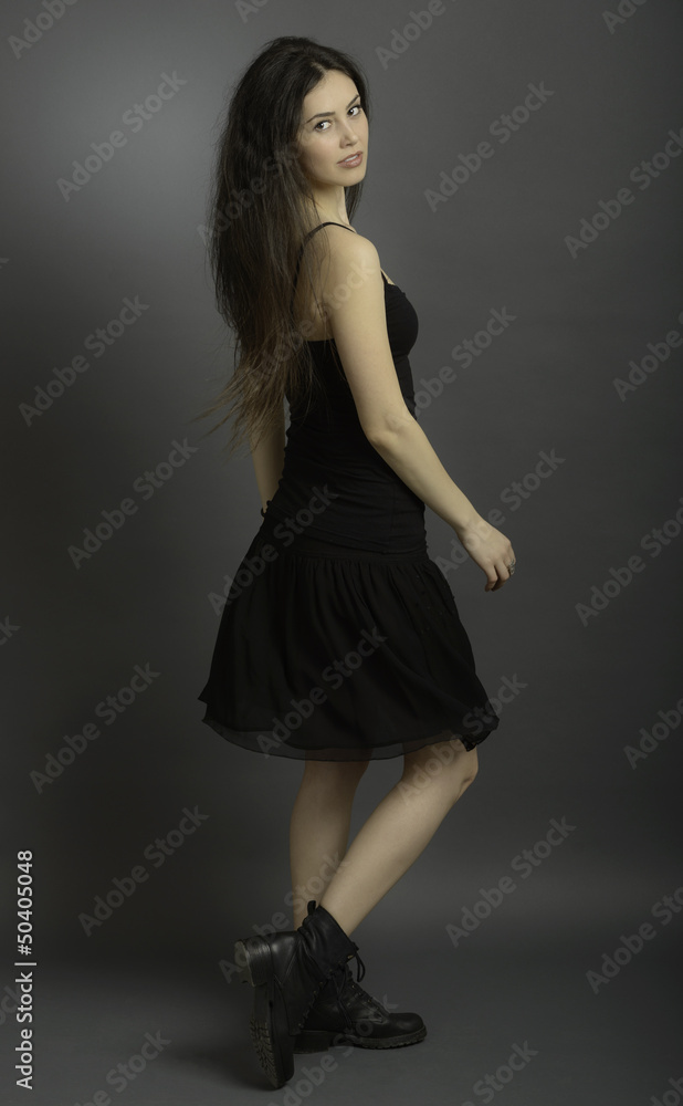 Portrait of beautiful brunette woman in black dress Portrait of beautiful brunette woman in black dress
