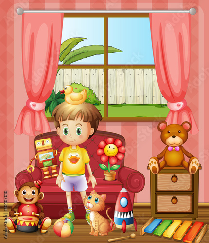 A kid inside the house with his toys