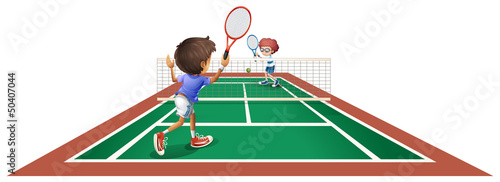 Two kids playing tennis