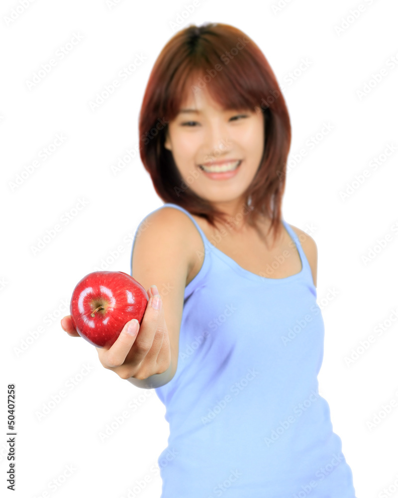 Isolated young asian woman with a red apple. Isolated young asian woman with a red apple.
