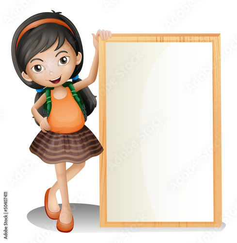 A young lady beside an empty signboard