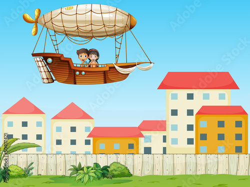 Two kids riding in an aircraft above the village