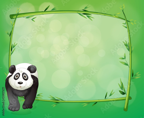 A big panda beside a bamboo frame