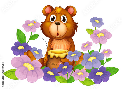 A bear holding a honey in the flower garden