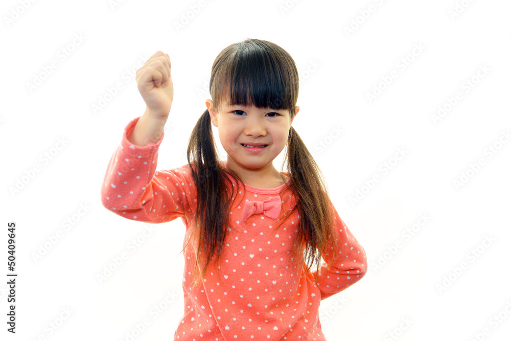 ガッツポーズをする笑顔の女の子 ガッツポーズをする笑顔の女の子