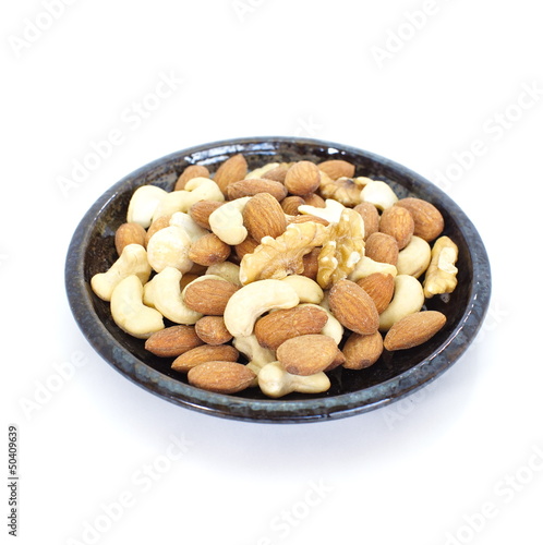 Various mixed nuts isolated on white background