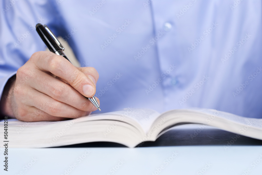 hand of a man and a ballpoint pen hand of a man and a ballpoint pen