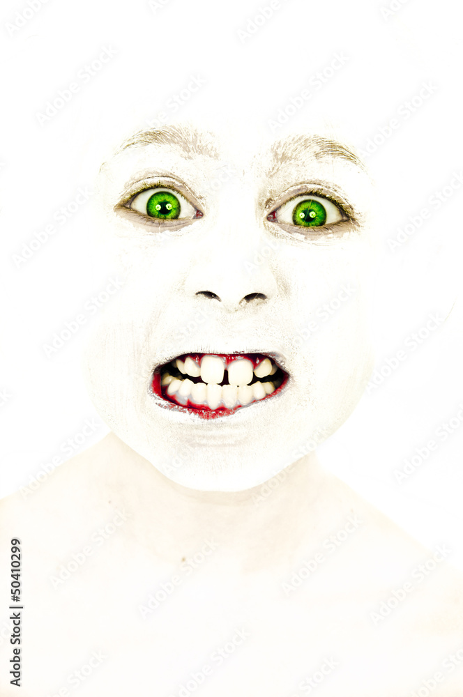 Little girl with painted face who grinds her teeth