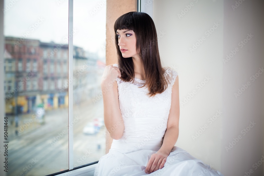 Bride looks out the window