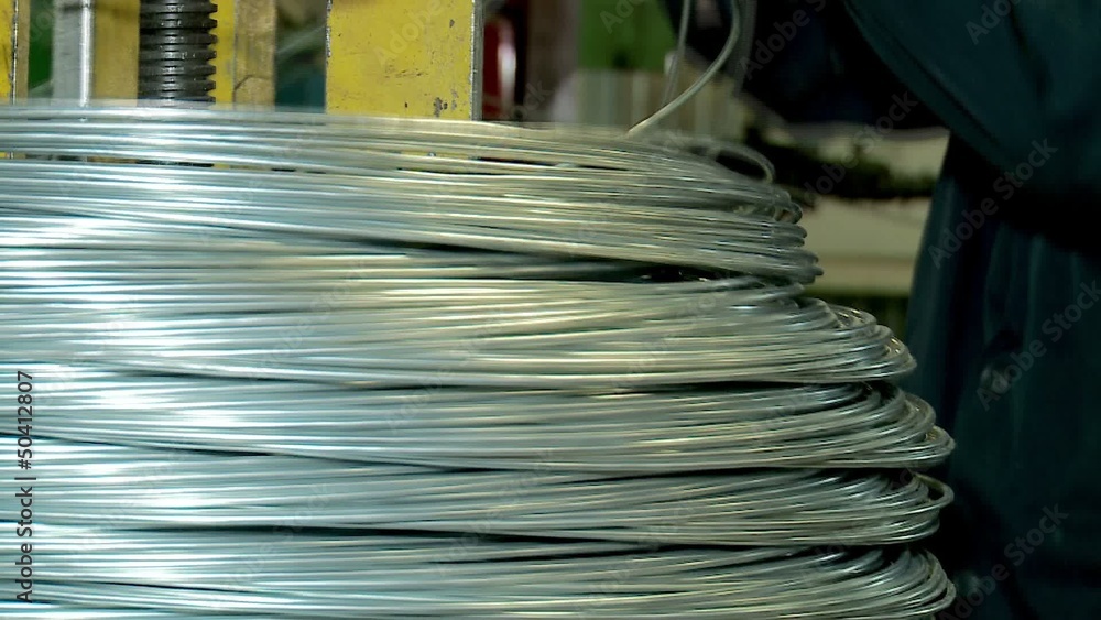 Mounting of the coil wire for nails production. Mounting of the coil wire for nails production.