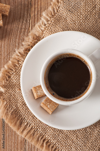 closeup view of a cup of coffee and brown sugar