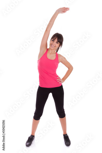Fitness woman stretching her leg to warm up