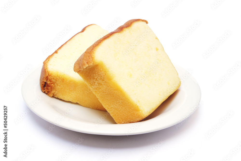 Sliced butter cake on plate with white background Sliced butter cake on plate with white background