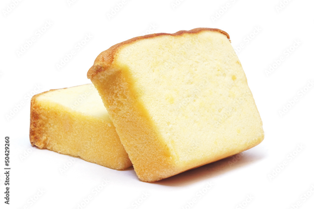 Sliced butter cake on white background