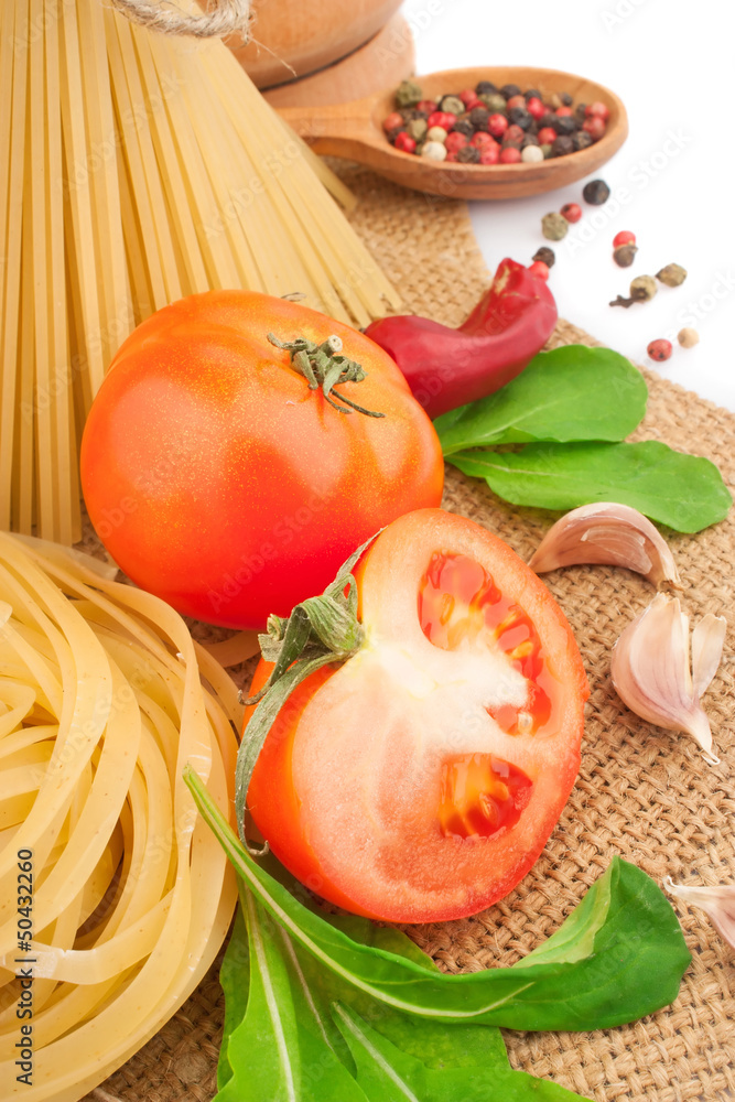 Italian pasta with spices and vegetables, food ingredients Italian pasta with spices and vegetables, food ingredients