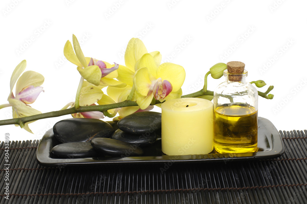 oil with yellow orchid and zen stones on mat oil with yellow orchid and zen stones on mat