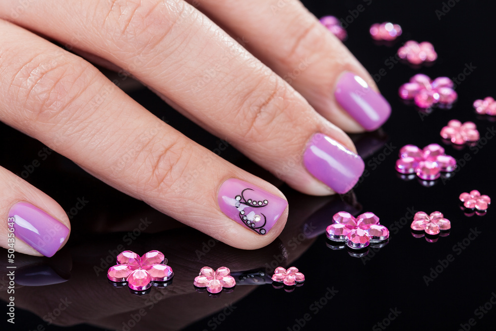 Fototapeta premium Close-up Of Fingernails And Rhinestones