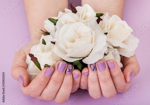 Close-up Of Hands Holding White Roses photo