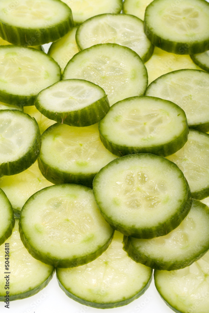 Freshly sliced cucumber isolated on white background Freshly sliced cucumber isolated on white background