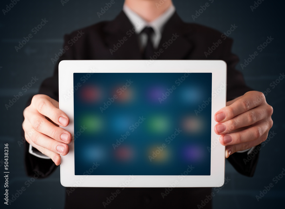 custom made wallpaper toronto digitalBusinessman holding a white modern tablet with blurry apps