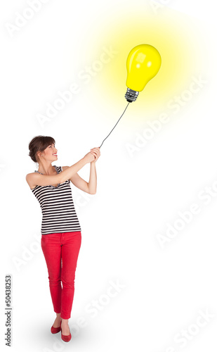 Happy woman holding a light bulb balloon © ra2 studio