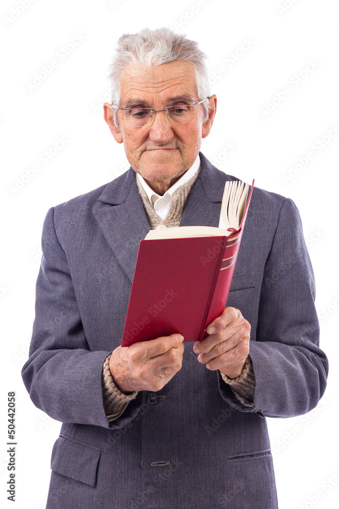 Portrait of an old man with glasses reading a book Portrait of an old man with glasses reading a book