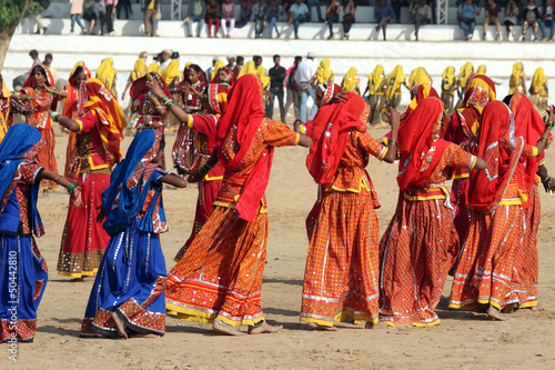 Indian girls dancing at Pushkar camel fair photo