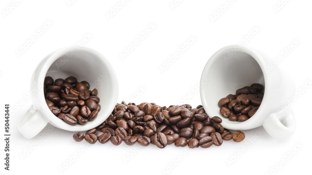 heap of coffee beans with two cups heap of coffee beans with two cups