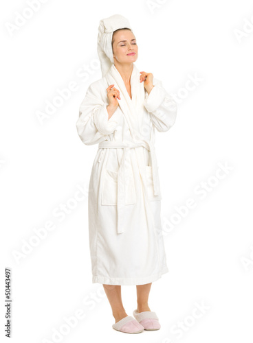фотографія Full length portrait of relaxed young woman in bathrobe