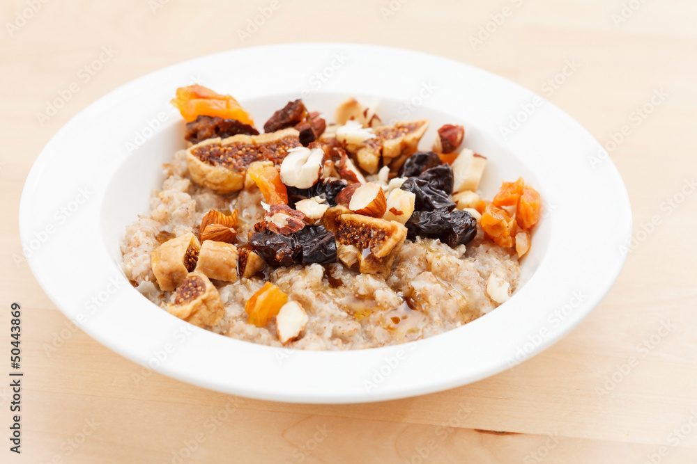 oatmeal with raisins, nuts and maple syrup oatmeal with raisins, nuts and maple syrup