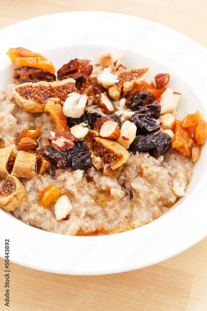 oatmeal with raisins, nuts and maple syrup