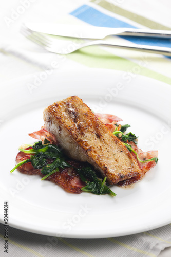 tilapia fillet with warm spinach and bacon salad