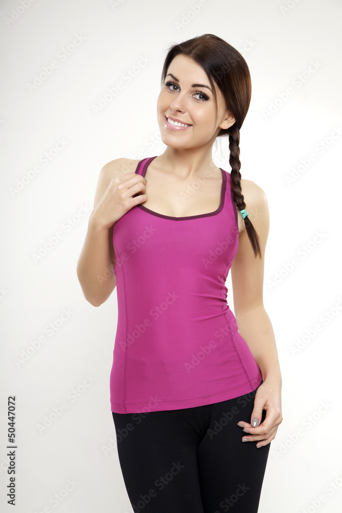 sporty woman in violet dress standing and looking on camera sporty woman in violet dress standing and looking on camera