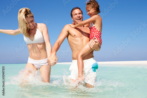 Family Having Fun In Sea On Beach Holiday © Monkey Business