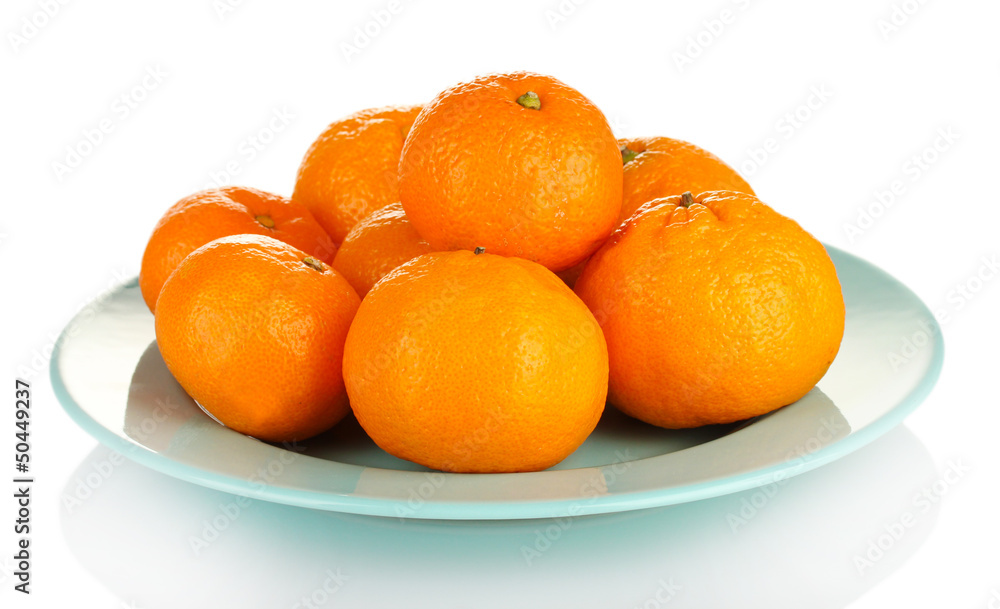 Tasty mandarines on color plate isolated on white Tasty mandarines on color plate isolated on white