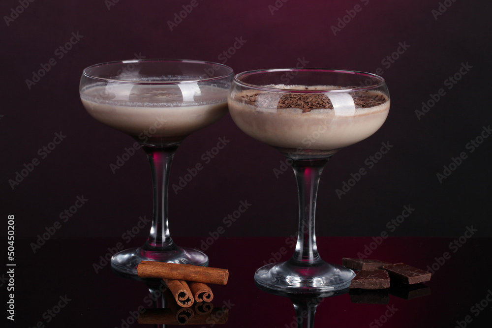 Cream cocktails on dark purple background