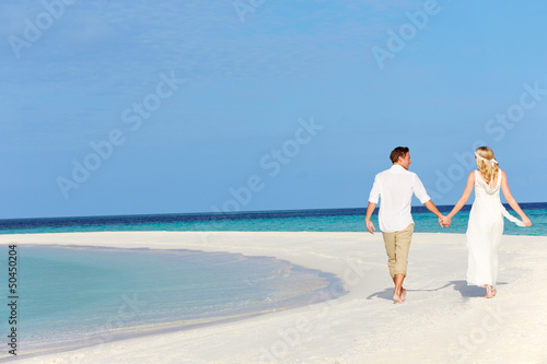 Couple At Beautiful Beach Wedding © Monkey Business