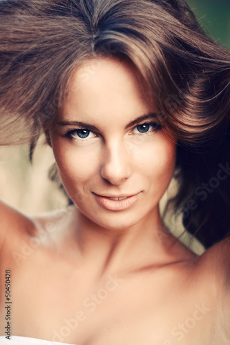 Сloseup portrait of young woman with beautiful hair