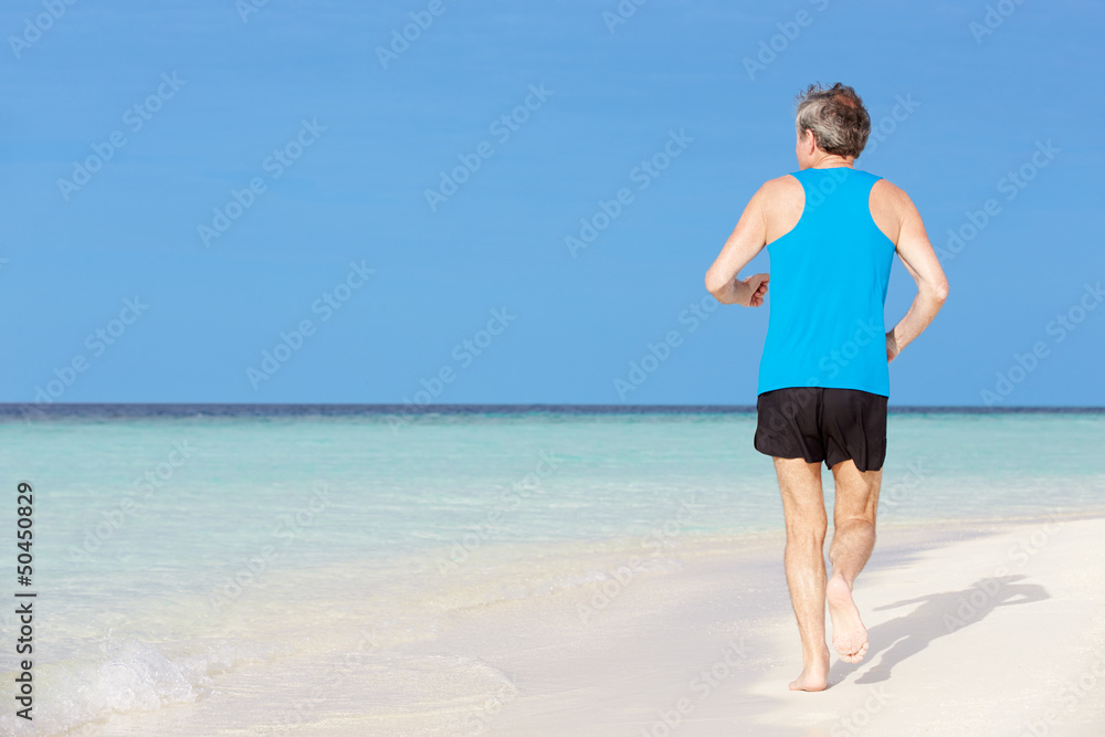 Senior Man Running On Beautiful Beach