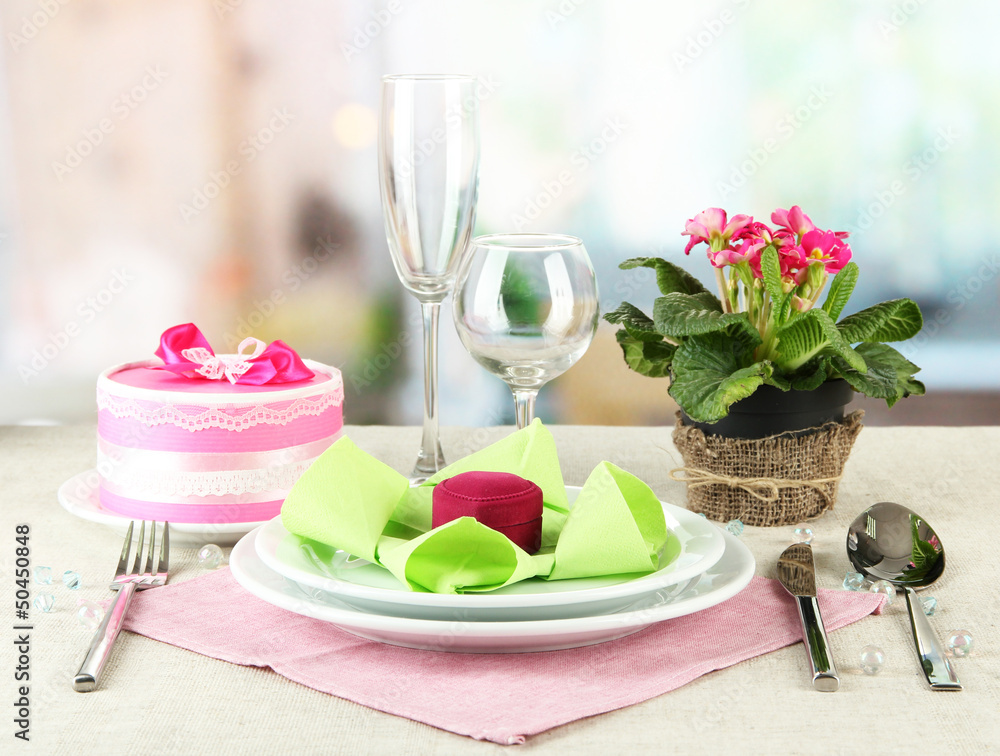 Romantic table serving on bright background