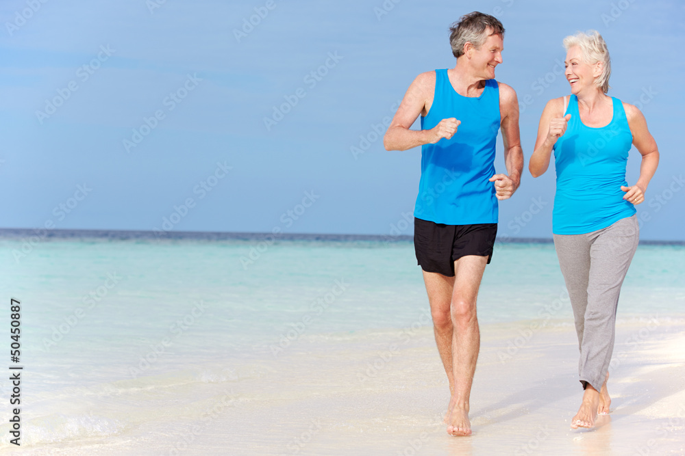 Senior Couple Running On Beautiful Beach Senior Couple Running On Beautiful Beach