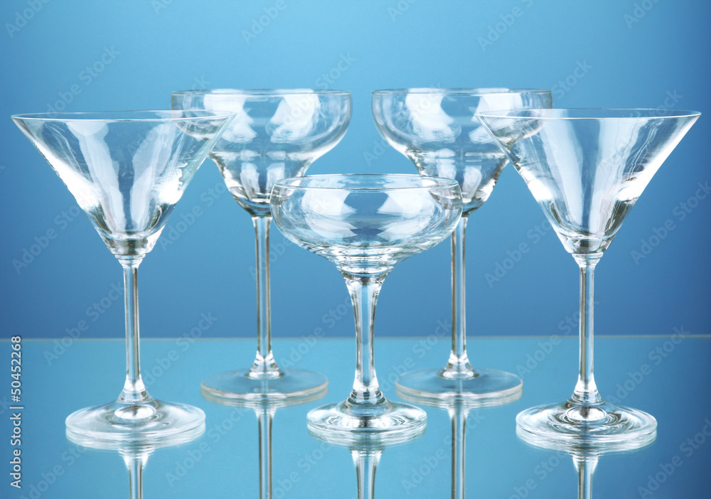 Cocktail glass set on blue background Cocktail glass set on blue background