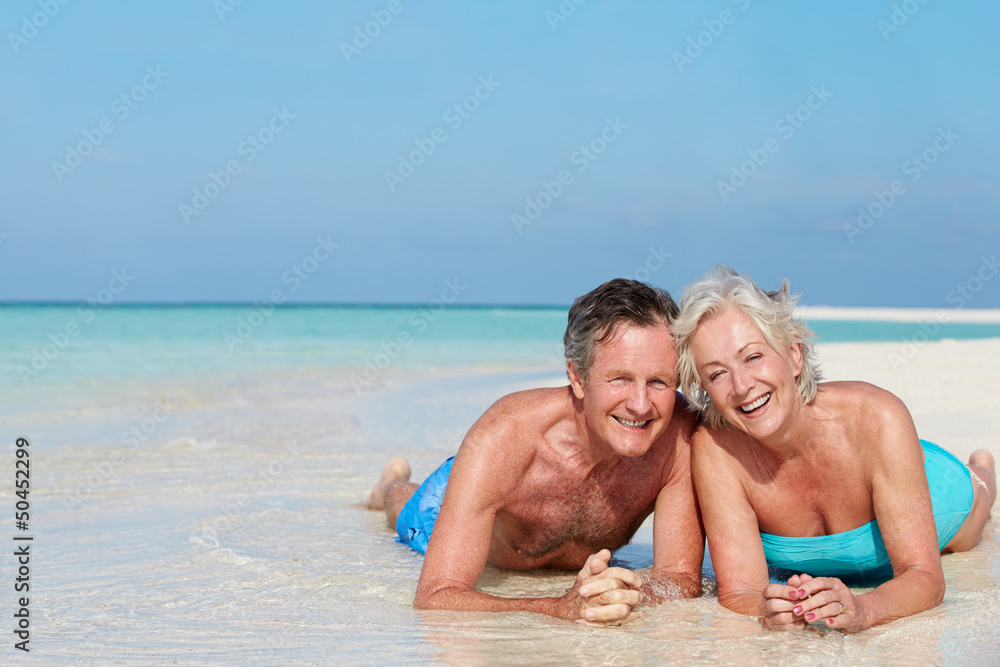 Senior Couple Enjoying Beach Holiday Senior Couple Enjoying Beach Holiday