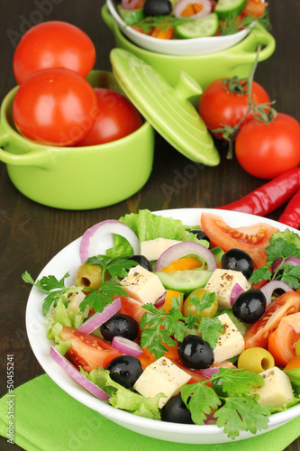 Greek salad in plate on wooden table © Africa Studio