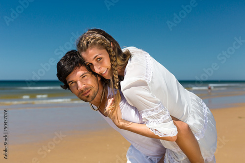 couple on the ocean beach enjoying their vacation