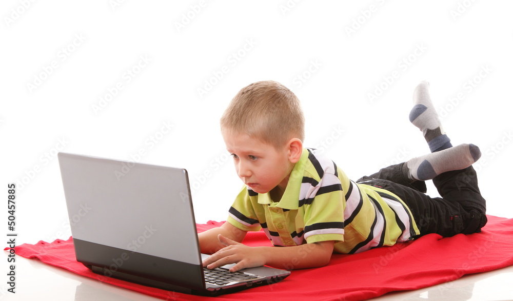 Computer addiction child with laptop notebook Computer addiction child with laptop notebook