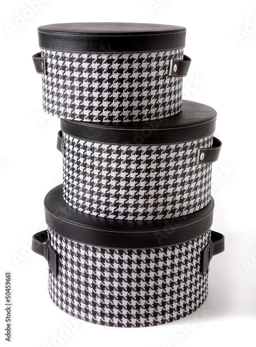 Set of houndstooth check and black leather bandboxes photo