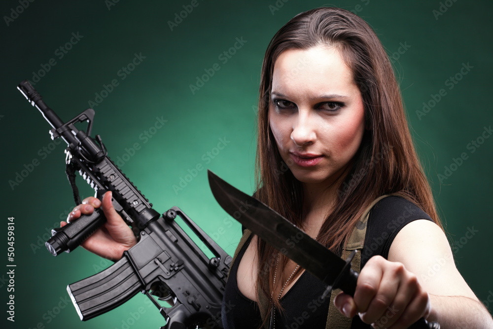 Sexy young woman long hair - gun knife