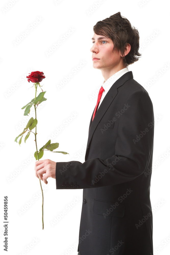 Young man presenting a flower red rose isolated Young man presenting a flower red rose isolated