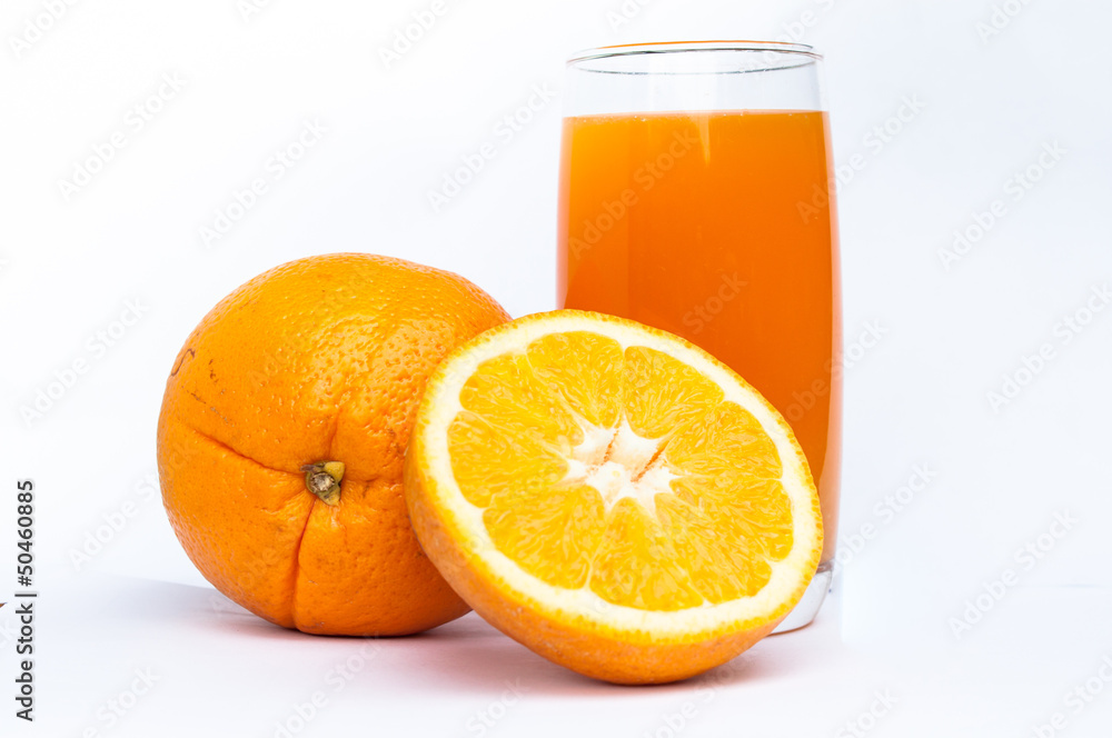 Orange juice glass and oranges Orange juice glass and oranges